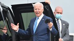 US President Joe Biden gestures to the media after arriving on Airforce One.