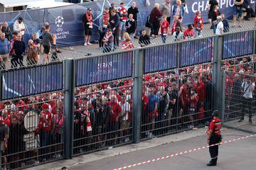 Liverpool fans stand outside unable to get in in time leading to the match being delayed prior to the UEFA Champions League 
