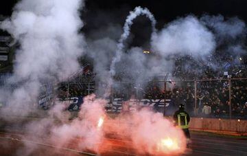 Fans of the Croatian club Dinamo Zagreb throw flares towards the pitch during the UEFA Cup match against Udinese in Udine
