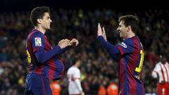 Messi y Bartra.