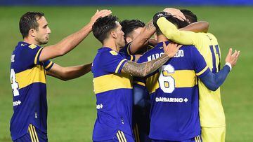 Players od Boca Juniors celebrate after defeating River Plate in the penalty shoot-out after tying 1-1 in their Argentine Professional Football League quarter-final match at La Bombonera stadium in Buenos Aires, on May 16, 2021. (Photo by Marcelo Endelli / POOL / AFP)