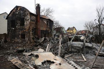 The remains of an unidentified military aeroplane lie in a residential area in Kyiv, after crashing into a house during a Russian air attack on Ukraine.