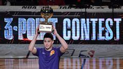 Feb 17, 2018; Los Angeles, CA, USA; Phoenix Suns guard Devin Booker (1) holds the trophy after winning the three point challenge in the 2018 All Star Saturday Night at Staples Center. Mandatory Credit: Richard Mackson-USA TODAY Sports