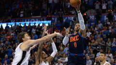 Dec 3, 2017; Oklahoma City, OK, USA; Oklahoma City Thunder guard Russell Westbrook (0) drives to the basket in front of San Antonio Spurs center Pau Gasol (16) and guard Dejounte Murray (5) during the first quarter at Chesapeake Energy Arena. Mandatory Cr