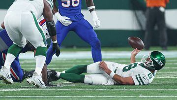 Sep 11, 2023; East Rutherford, New Jersey, USA; New York Jets quarterback Aaron Rodgers (8) reacts after being sacked by Buffalo Bills defensive end Leonard Floyd (56) during the first half at MetLife Stadium. Mandatory Credit: Vincent Carchietta-USA TODAY Sports