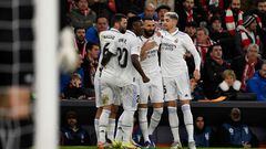 Real Madrid's French forward Karim Benzema (2nd-R) celebrates with (From L) Real Madrid's Spanish defender Nacho Fernandez, Real Madrid's Brazilian forward Vinicius Junior, and Real Madrid's Uruguayan midfielder Federico Valverde after scoring his team's first goal during the Spanish league football match between Athletic Club Bilbao and Real Madrid CF at the San Mames stadium in Bilbao, on January 22, 2023. (Photo by ANDER GILLENEA / AFP)
