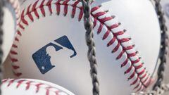 (FILES) In this file photo taken on June 27, 2018 a baseball with MLB logo is seen at Citizens Bank Park before a game between the Washington Nationals and Philadelphia Phillies in Philadelphia, Pennsylvania. - Nine players and four staffers tested positi