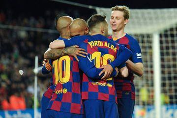 Rewarded | FC Barcelona's Lionel Messi celebrates with other first team players.