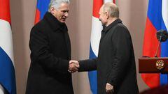 Cuban President Miguel Diaz-Canel Bermudez (L) and Russian President Vladimir Putin (R) shake hands during the inauguration of a monument to late Cuban leader Fidel Castro in Moscow on November 22, 2022. (Photo by Sergei GUNEYEV / SPUTNIK / AFP) (Photo by SERGEI GUNEYEV/SPUTNIK/AFP via Getty Images)