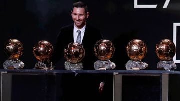 Messi poses with his six Ballon d&#039;Or trophies
