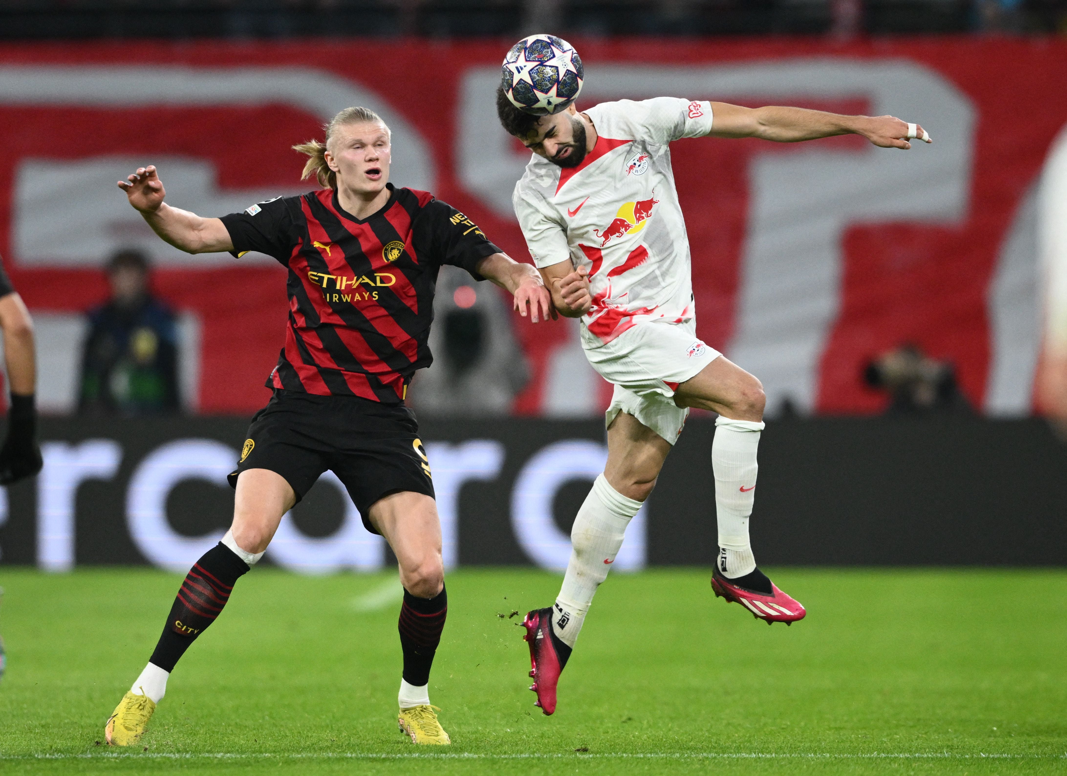 Soccer Football - Champions League - Round of 16 First Leg - RB Leipzig v Manchester City - Red Bull Arena, Leipzig, Germany - February 22, 2023 Manchester City's Erling Braut Haaland in action with RB Leipzig's Josko Gvardiol REUTERS/Annegret Hilse