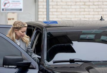 Actor Amber Heard gets into the car as she leaves the Fairfax County Circuit Courthouse