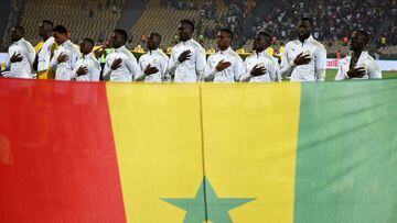 Senegal&#039;s players sing the national anthem before the Africa Cup of Nations (CAN) 2021 semi final football match between Burkina Faso and Senegal at Stade Ahmadou-Ahidjo in Yaounde on February 2, 2022. (Photo by CHARLY TRIBALLEAU / AFP)