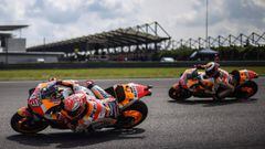 Repsol Honda Teamx92s Spanish rider Marc Marquez (L) and his teammate Spanish rider Jorge Lorenzo (R) take a corner during the first MotoGP free practice at the Sepang International Circuit on November 1, 2019, ahead of the Malaysian motorcycle Grand Prix
