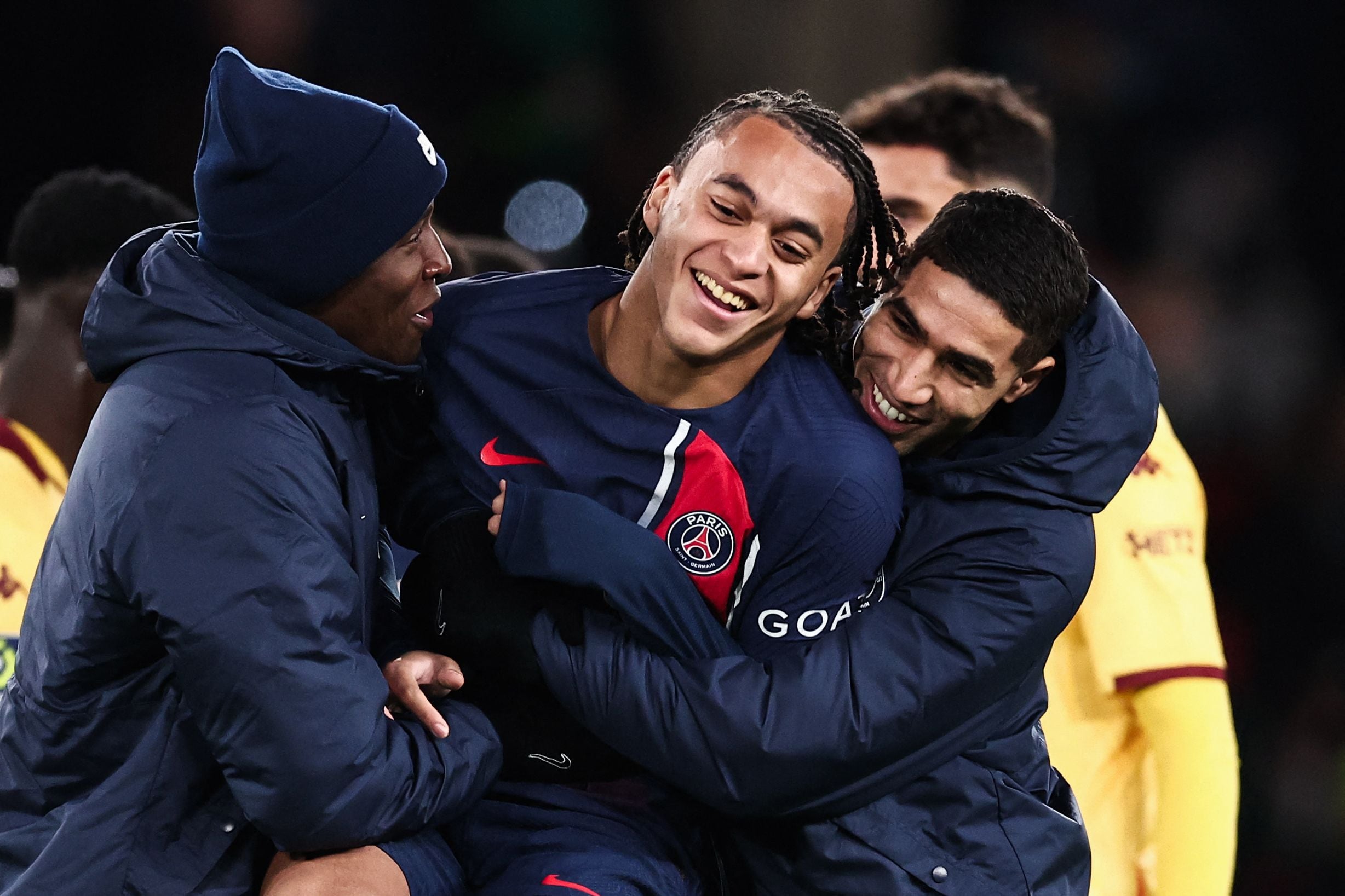 Paris Saint-Germain's midfielder #38 Ethan Mbappe (C) celebrates with Paris Saint-Germain's Moroccan defender #02 Achraf Hakimi after winning the French L1 football match between Paris Saint-Germain (PSG) and FC Metz at the Parc des Princes stadium in Paris, on December 20, 2023. (Photo by FRANCK FIFE / AFP)