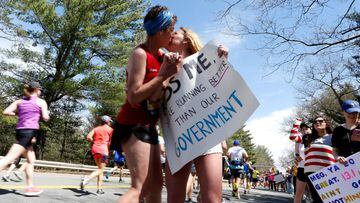 Runners are cheered on by Courtney Peterson, 21, in front of the Wellesley College Campus during the 121st running of the Boston Marathon in Wellesley, Massachusetts, U.S. April 17, 2017.      REUTERS/Lisa Hornak