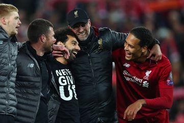 LIVERPOOL, ENGLAND - MAY 07:  Jurgen Klopp, Manager of Liverpool, Mohamed Salah of Liverpool and Virgil van Dijk celebrate after the UEFA Champions League Semi Final second leg match between Liverpool and Barcelona at Anfield on May 07, 2019 in Liverpool,