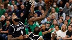 Boston Celtics guard Jaylen Brown goes to the basket on Brooklyn Nets center Andre Drummond and forward Kevin Durant during the first quarter of game two of the first round for the 2022 NBA playoffs at TD Garden.