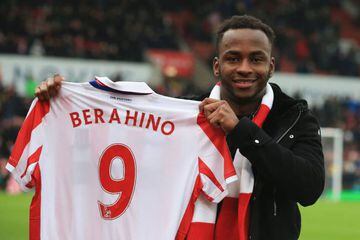 Stoke City's new signing, English striker Saido Berahino posing for a photograph with his jersey.