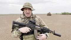 FILE PHOTO: The late Yevgeny Prigozhin, chief of Russian private mercenary group Wagner, then giving an address in camouflage and with a weapon in his hands in a desert area at an unknown location, in this still image taken from video possibly shot in Africa and published August 21, 2023. Courtesy PMC Wagner via Telegram via REUTERS/File Photo
