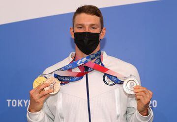 Ryan Murphy of Team United States poses for a photo with his Gold, Silver and Bronze medals during the United States Swimming press conference on day nine of the Tokyo Olympic Games on August 01, 2021 in Tokyo, Japan.