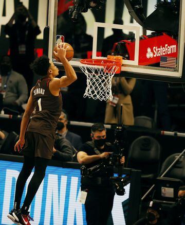 Anfernee Simons of the Portland TrailBlazers performs his final dunk en route to winning the Slam Dunk Contest during halftime of the NBA All-Star Game at State Farm Arena in Atlanta, Georgia.