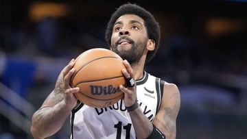 ORLANDO, FLORIDA - MARCH 15: Kyrie Irving #11 of the Brooklyn Nets drives to the basket against the Orlando Magic in the first half at Amway Center on March 15, 2022 in Orlando, Florida. NOTE TO USER: User expressly acknowledges and agrees that, by downlo