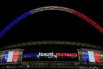 England face France at the new Wembley in 2015 with the new arches paying tribute to the dead in the Paris terror attacks.