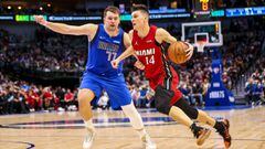 Nov 2, 2021; Dallas, Texas, USA; Miami Heat guard Tyler Herro (14) drives to the basket as Dallas Mavericks guard Luka Doncic (77) defends during the fourth quarter at American Airlines Center. Mandatory Credit: Kevin Jairaj-USA TODAY Sports