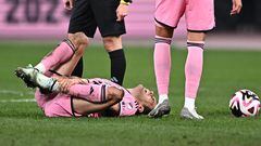Inter Miami's midfielder Sergio Busquets (L) reacts after being injured during the friendly football match between Inter Miami of the US's Major League Soccer league and Vissel Kobe of Japan's J-League at the National Stadium in Tokyo on February 7, 2024. (Photo by Philip FONG / AFP)