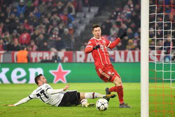 MUNICH, GERMANY - FEBRUARY 20: Robert Lewandowski of Bayern Muenchen scores his sides fifth goal.