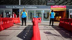 Policemen stand guard at the entrance of the subway, in Buenos Aires, on April 17, 2020 amid the COVID-19 coronavirus pandemic. (Photo by RONALDO SCHEMIDT / AFP)