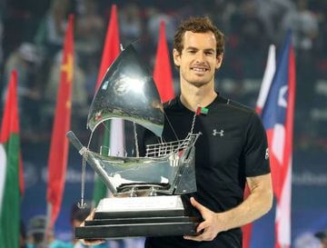 World number one Andy Murray of Great Britain celebrates with the championship trophy.