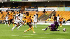WOLVERHAMPTON, ENGLAND - OCTOBER 04: Nelson Semedo of Wolverhampton Wanderers is closed down by Alphonso Areola of Fulham during the Premier League match between Wolverhampton Wanderers and Fulham at Molineux on October 04, 2020 in Wolverhampton, England.
