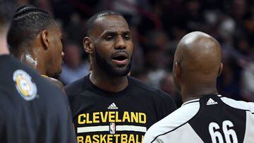 Apr 10, 2017; Miami, FL, USA; Cleveland Cavaliers forward LeBron James (C) talks with NBA referee Haywoode Workman (R) during the second half against the Miami Heat at American Airlines Arena. The Heat won 124-121 in overtime. Mandatory Credit: Steve Mitc
