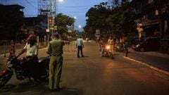 Police personnel check vehicles during a day-long complete lockdown imposed by the state government against the surge in COVID-19 coronavirus cases in Siliguri on August 8, 2020. - India&#039;s official coronavirus case tally passed two million on on Augu