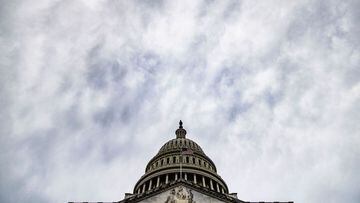 The US Capitol building is seen bellow an overcast sky on Capitol Hill in Washington, DC on April 29, 2021. (Photo by Samuel Corum / AFP)