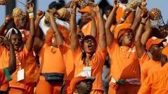 An Ivory Coast&#039;s fan cheers for her team prior to the 2019 Africa Cup of Nations (CAN) Round of 16 football match between Ivory Coast and Mali at the Suez Stadium in the north-eastern Egyptian city on July 8, 2019. (Photo by FADEL SENNA / AFP)