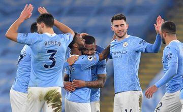 Manchester City's Brazilian striker Gabriel Jesus (C) is mobbed by teammates after scoring his team's fourth goal, his second, during the English Premier League football match between Manchester City and Wolverhamptom Wanderers