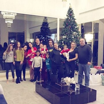 Cristiano Ronaldo gathers around the Christmas tree with his family.