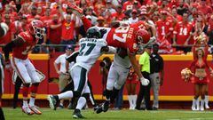 KANSAS CITY, MO - SEPTEMBER 17: Tight end Travis Kelce #87 of the Kansas City Chiefs leaps into the end zone over Malcolm Jenkins #27 and Rasul Douglas #32 of the Philadelphia Eagles in the fourth quarter of the game at Arrowhead Stadium on September 17, 2017 in Kansas City, Missouri. ( Photo by Peter Aiken/Getty Images) == FOR NEWSPAPERS, INTERNET, TELCOS &amp; TELEVISION USE ONLY ==