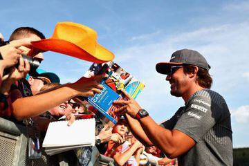 Fernando Alonso of McLaren Honda signs autographs for fans during previews ahead of the Formula One Grand Prix of Belgium at Circuit de Spa-Francorchamps.