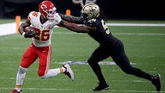 NEW ORLEANS, LOUISIANA - DECEMBER 20: Demario Davis #56 of the New Orleans Saints grabs the face mask of Le&#039;Veon Bell #26 of the Kansas City Chiefs during the fourth quarter in the game at Mercedes-Benz Superdome on December 20, 2020 in New Orleans, 