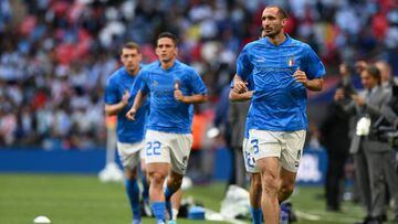 Italy's defender Giorgio Chiellini (R) and teammates warm up ahead of the 'Finalissima' International friendly football match between Italy and Argentina at Wembley Stadium in London on June 1, 2022. - The Azzurri face the South American continental champions in the inaugural Finalissima at Wembley. (Photo by Glyn KIRK / AFP) (Photo by GLYN KIRK/AFP via Getty Images)