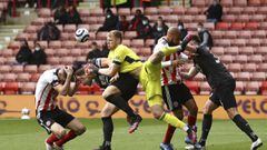 Sheffield United&#039;s Chris Basham, left, collides with Burnley&#039;s James Tarkowski during the English Premier League soccer match between Sheffield United and Burnley at Bramall Lane, Sheffield, England, Sunday, May 23, 2021. (Tim Goode/Pool Photo v
