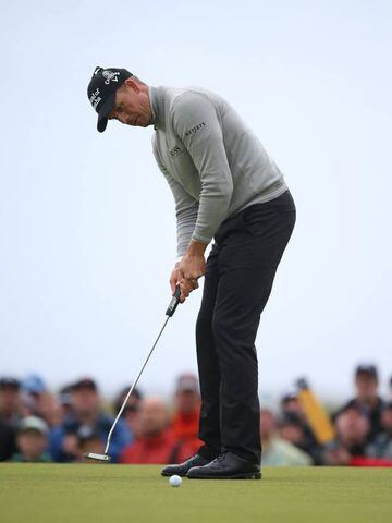 Stenson holes his birdie putt on the 17th green during the third roun.