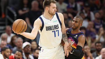 Luka Doncic of the Dallas Mavericks handles the ball against Chris Paul of the Phoenix Suns during the first half of Game Seven of the Western Conference Second Round NBA Playoffs at Footprint Center.