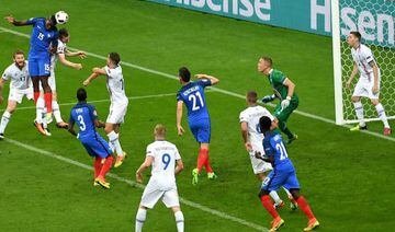 Paul Pogba (2-L) of France scores the 2-0 goal during the UEFA EURO 2016 quarter final match between France and Iceland