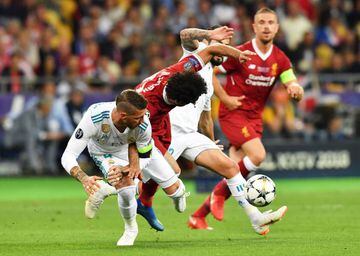 Real Madrid's Sergio Ramos entangled with Liverpool's Mohamed Salah during the 2018 Champions League final in Kiev