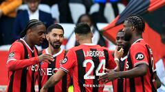 Nice's Nigerian forward #09 Terem Moffi (R) celebrates with teammates after scoring his team's first goal during the French L1 football match between OGC Nice and Toulouse FC at the Allianz Riviera Stadium in Nice, south-eastern France, on November 26, 2023. (Photo by Valery HACHE / AFP)